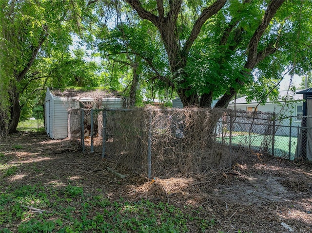1720 Kendrick Ln, Lakeland, FL 33805 - view of yard with fence, an outdoor structure, and a storage shed