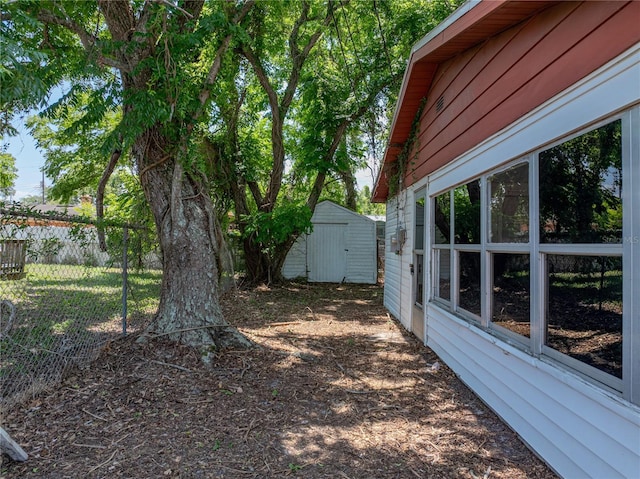 1720 Kendrick Ln, Lakeland, FL 33805 - view of yard featuring fence, a shed, and an outbuilding