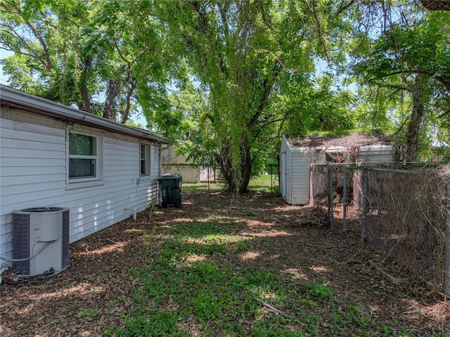 1720 Kendrick Ln, Lakeland, FL 33805 - view of yard with a fenced backyard and central air condition unit