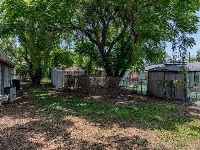 1720 Kendrick Ln, Lakeland, FL 33805 - view of yard with an outbuilding, a shed, and a fenced backyard