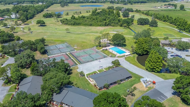aerial view featuring view of golf course and a water view