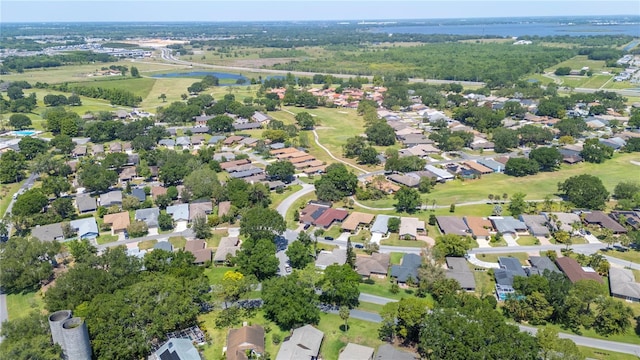 birds eye view of property featuring a residential view and a water view