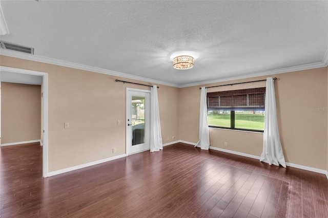 unfurnished room featuring visible vents, plenty of natural light, and dark wood-type flooring