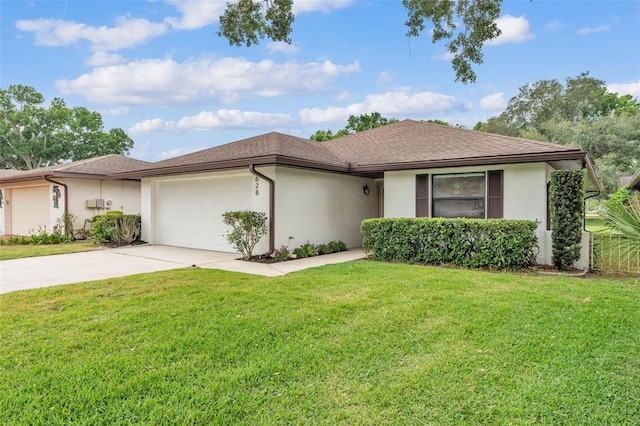 ranch-style house featuring concrete driveway, an attached garage, a front yard, and stucco siding