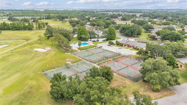 birds eye view of property with view of golf course