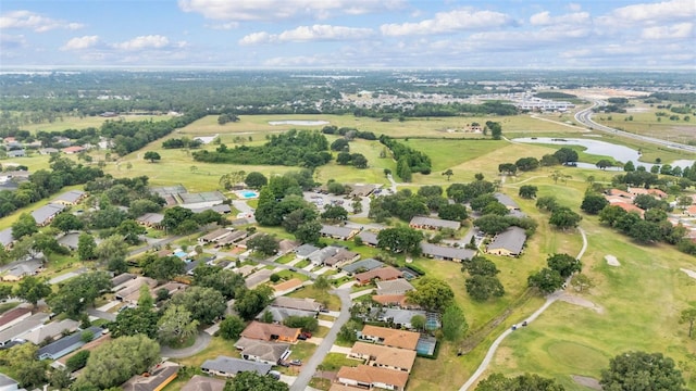 birds eye view of property featuring a residential view, view of golf course, and a water view