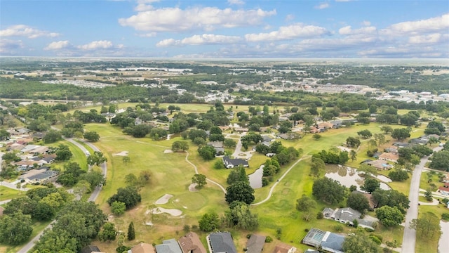 birds eye view of property with a residential view and view of golf course