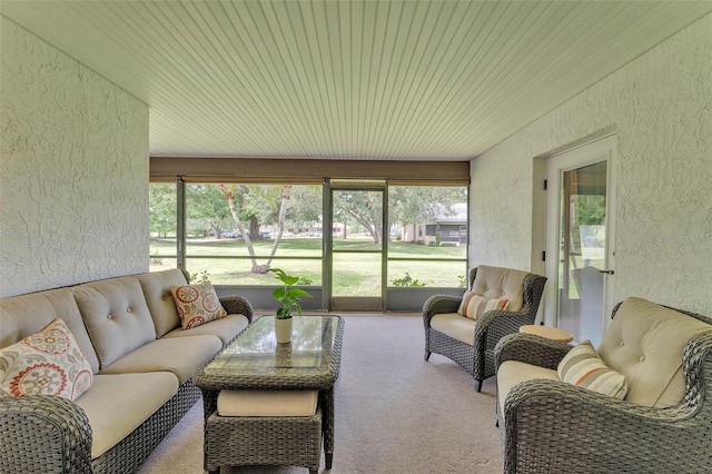 sunroom featuring an outdoor living space