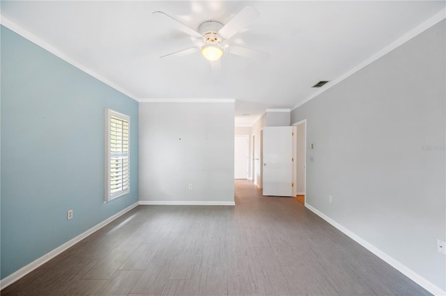 unfurnished room with ceiling fan, ornamental molding, wood finished floors, and baseboards