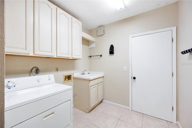 washroom with washer / clothes dryer, cabinet space, light tile patterned floors, and baseboards