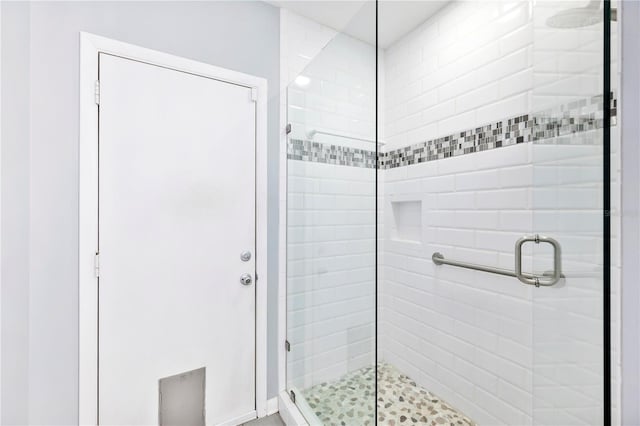 bathroom featuring a shower stall