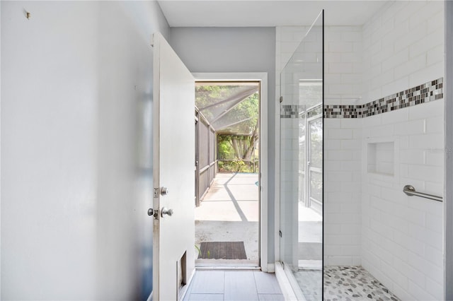bathroom featuring tiled shower