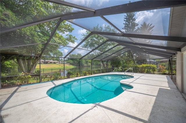 swimming pool with a patio and a lanai