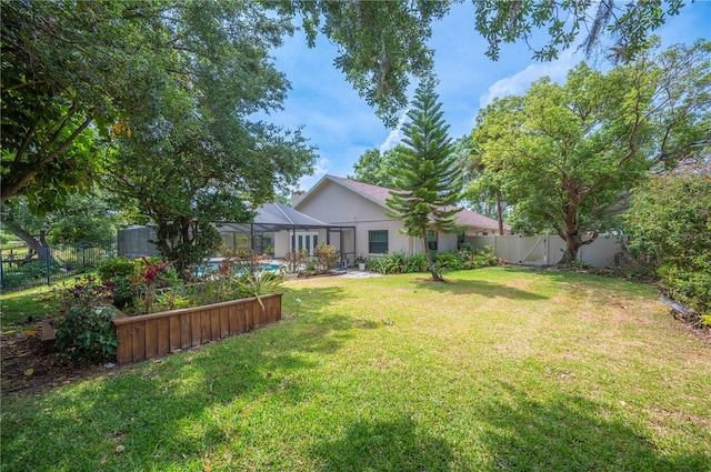 view of yard featuring a lanai
