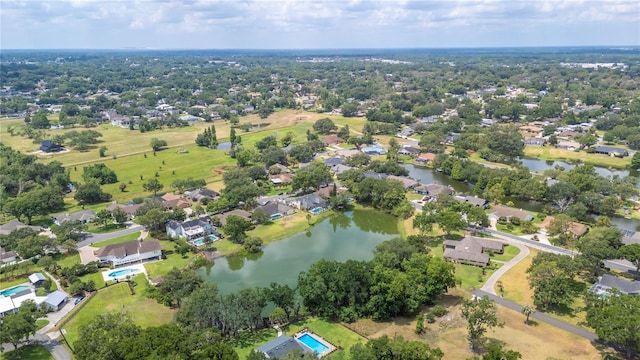 aerial view of residential area featuring a nearby body of water