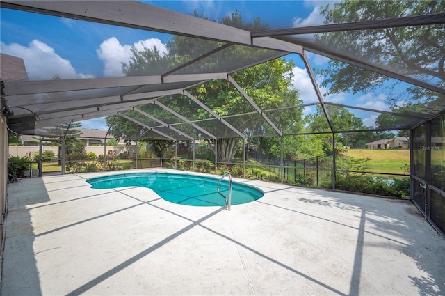 view of pool with a patio, a lanai, and a fenced backyard