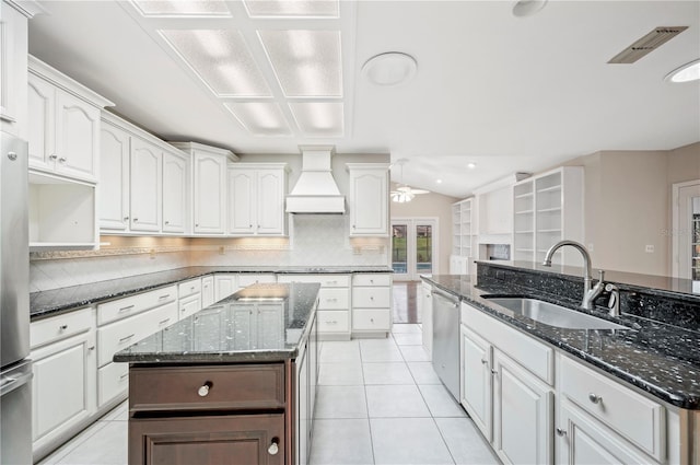 1104 Kells Ct, Lakeland, FL 33813 - kitchen featuring custom exhaust hood, a sink, a ceiling fan, stainless steel appliances, and light tile patterned floors