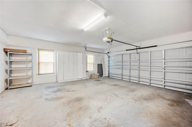 1104 Kells Ct, Lakeland, FL 33813 - garage featuring a garage door opener