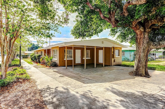 ranch-style home with fence and driveway