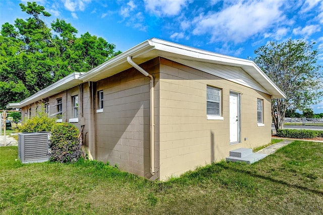 view of property exterior featuring a lawn