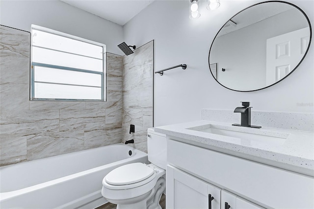 bathroom with shower / washtub combination, toilet, and vanity