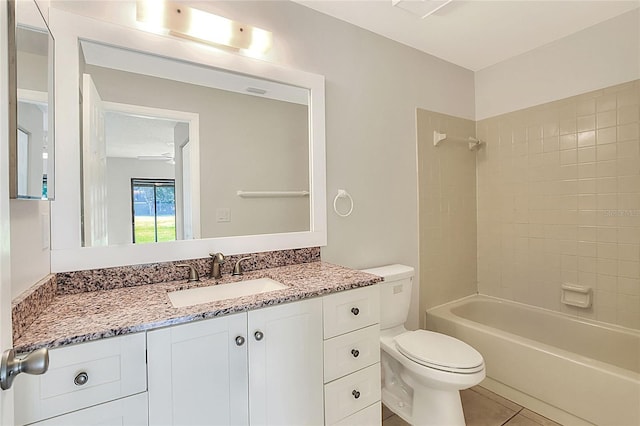 full bathroom with tile patterned floors, shower / bathtub combination, vanity, and toilet