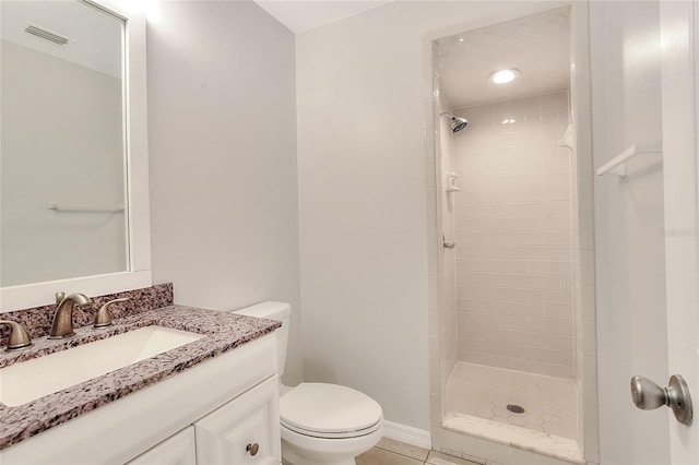 bathroom featuring a tile shower, toilet, tile patterned floors, and visible vents