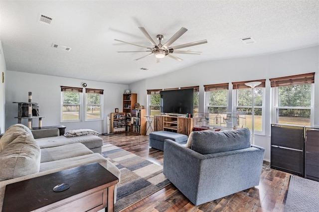 living room featuring visible vents, a ceiling fan, and lofted ceiling