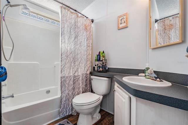bathroom with vanity, wood finished floors, toilet, a textured ceiling, and shower / bath combo