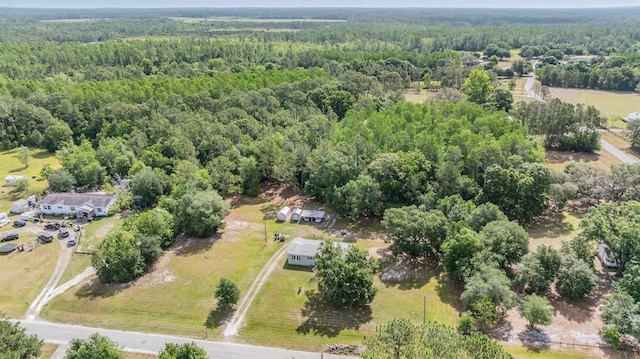 bird's eye view featuring a forest view