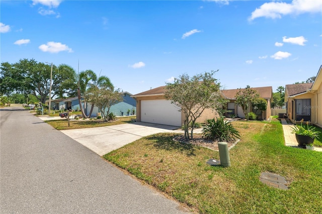 view of front facade featuring concrete driveway, a front lawn, an attached garage, stucco siding, and a residential view