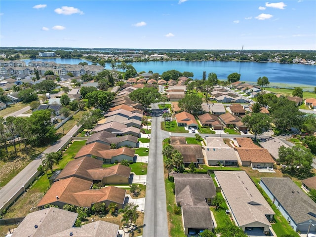 drone / aerial view with a residential view and a water view