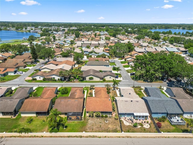 aerial view featuring a water view and a residential view
