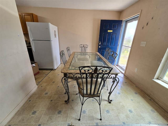 911 White Ln NE, Steinhatchee, FL 32359 - dining space with a wealth of natural light and baseboards