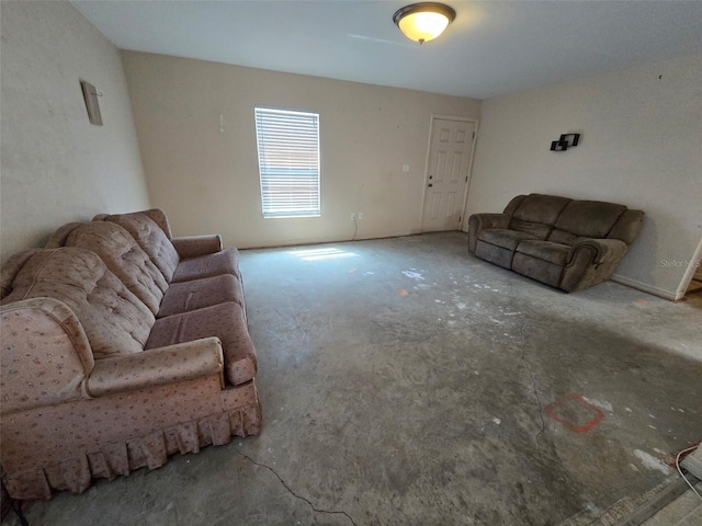 911 White Ln NE, Steinhatchee, FL 32359 - unfurnished living room with unfinished concrete floors