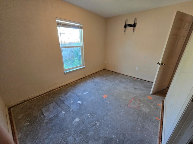 911 White Ln NE, Steinhatchee, FL 32359 - spare room featuring concrete flooring