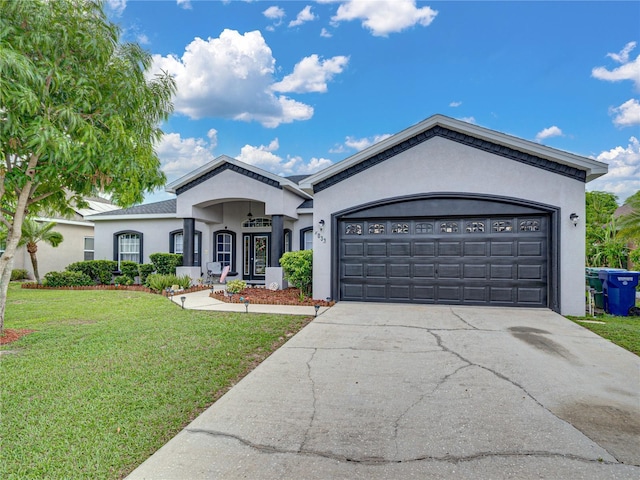 2033 Normandy Heights Dr, Winter Haven, FL 33880 - single story home with stucco siding, driveway, a front lawn, and an attached garage