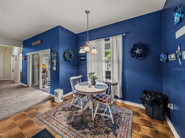 2033 Normandy Heights Dr, Winter Haven, FL 33880 - dining space featuring a textured wall and baseboards