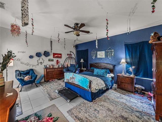 2033 Normandy Heights Dr, Winter Haven, FL 33880 - tiled bedroom featuring a textured wall and a ceiling fan