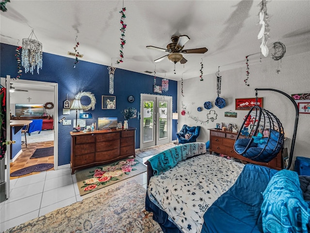 2033 Normandy Heights Dr, Winter Haven, FL 33880 - bedroom with tile patterned floors, a textured wall, access to exterior, baseboards, and ceiling fan