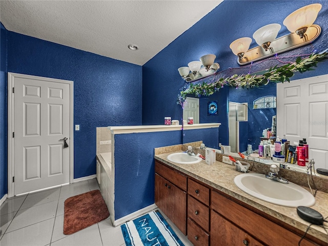 2033 Normandy Heights Dr, Winter Haven, FL 33880 - full bath with a textured wall, a textured ceiling, tile patterned flooring, double vanity, and a bath
