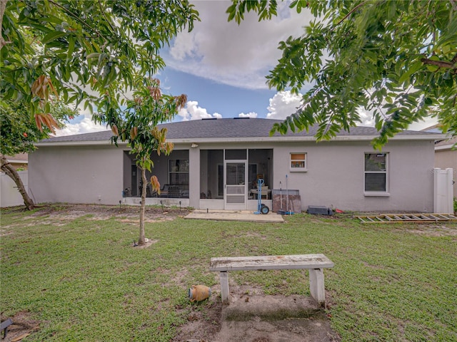 2033 Normandy Heights Dr, Winter Haven, FL 33880 - rear view of house featuring a sunroom and stucco siding