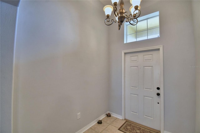 3684 Madbury Cir, Lakeland, FL 33810 - entryway with baseboards, an inviting chandelier, and light tile patterned floors