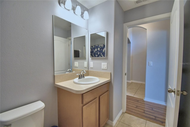 3684 Madbury Cir, Lakeland, FL 33810 - bathroom with visible vents, tile patterned floors, vanity, and toilet
