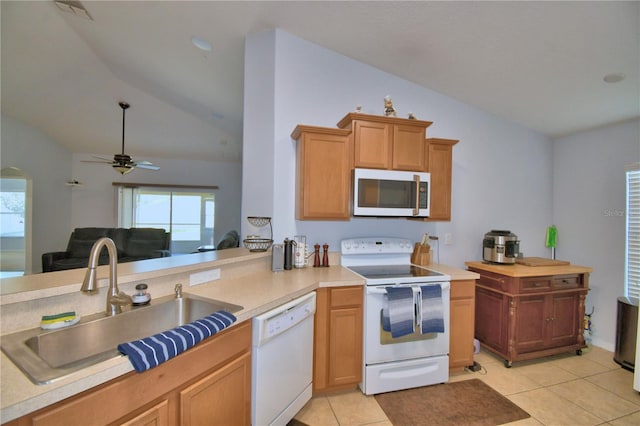 3684 Madbury Cir, Lakeland, FL 33810 - kitchen with lofted ceiling, a sink, light tile patterned flooring, white appliances, and ceiling fan