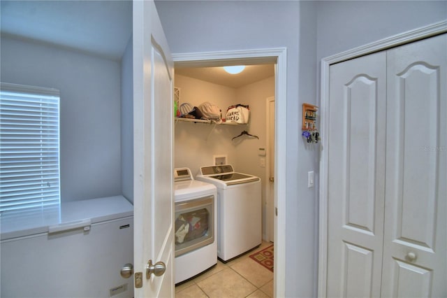 3684 Madbury Cir, Lakeland, FL 33810 - laundry room with light tile patterned flooring, washing machine and clothes dryer, and laundry area