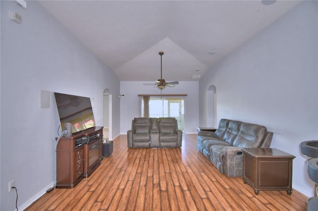 3684 Madbury Cir, Lakeland, FL 33810 - living area with vaulted ceiling, wood finished floors, ceiling fan, arched walkways, and visible vents