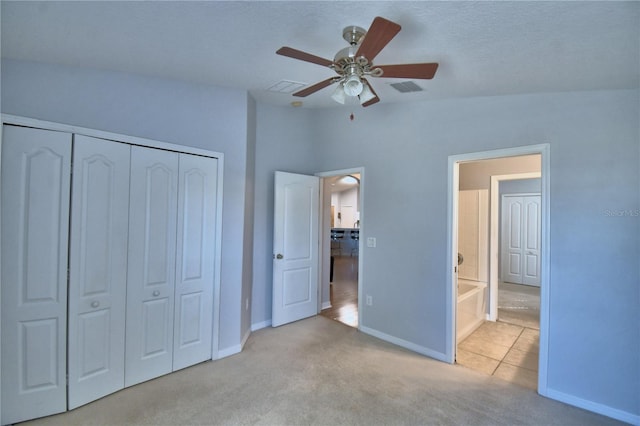 3684 Madbury Cir, Lakeland, FL 33810 - unfurnished bedroom featuring carpet floors, a closet, visible vents, and baseboards