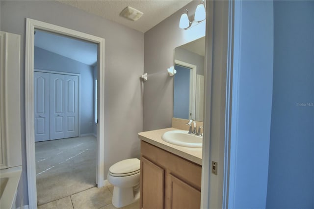3684 Madbury Cir, Lakeland, FL 33810 - bathroom with a textured ceiling, vanity, toilet, tile patterned flooring, and visible vents