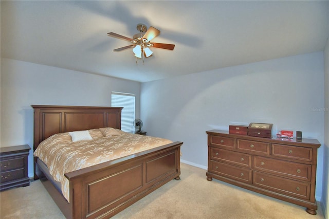3684 Madbury Cir, Lakeland, FL 33810 - bedroom with light carpet, baseboards, and ceiling fan